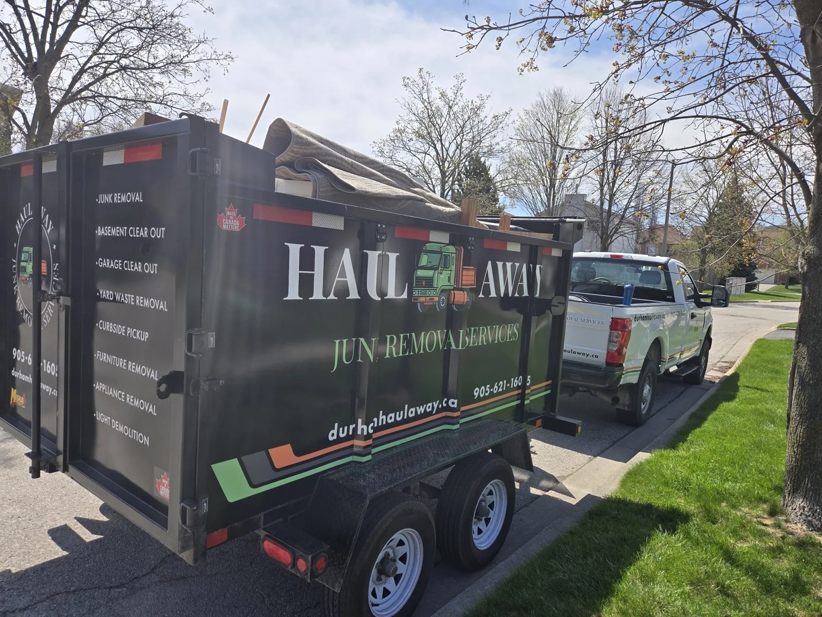 Junk removal truck being loaded with household furniture in Brownsville Texas